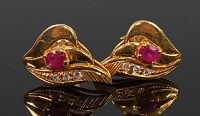 Lot 2217 - A pair of 18ct gold, ruby and three diamond...