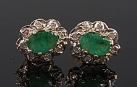 Lot 2218 - A pair of 9ct gold, emerald and diamond point...