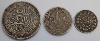 Lot 50 - Three Middle Eastern silver coins, to include;...