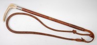 Lot 589 - An early 20th century leather clad riding crop,...