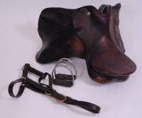 Lot 595 - A modern brown leather riding saddle, bearing...