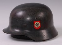 Lot 310 - A German SS M35 steel helmet with ducals,...