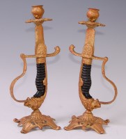 Lot 312 - A pair of modern gilt metal table candlesticks,...