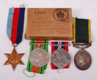Lot 373 - A Geo. VI group of four medals to include 1939-...