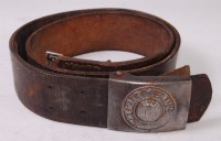 Lot 381 - A German Wehrmacht belt buckle on a brown...