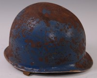 Lot 419 - A WW II American M1 steel helmet with inner...