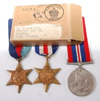 Lot 478 - A WW II group of three to include 1939-45 Star,...
