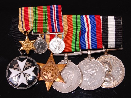 Lot 330 - A group of five medals to include The Order of...