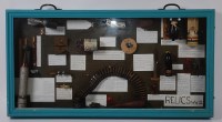Lot 536 - A framed and glazed display of WW II relics to...