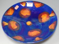 Lot 61 - A Poole Pottery Galaxy plate on a blue ground...