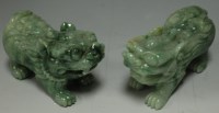 Lot 252 - A pair of Chinese carved jadeite Fo dogs, 12cm