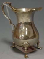 Lot 268 - A Georgian style silver cream jug of helmet...