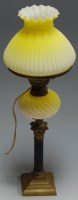 Lot 44 - A 19th century oil lamp having a yellow tinted...