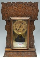Lot 19 - A late 19th century oak cased mantel clock by...