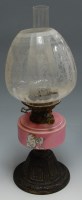 Lot 25 - A Victorian pedestal oil lamp having etched...