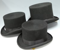 Lot 167 - Four modern black top hats each bearing a...