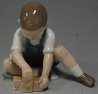 Lot 223 - *A Bing & Grondhal porcelain figure of a young...