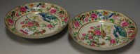 Lot 226 - *A pair of Chinese export famille rose saucers,...