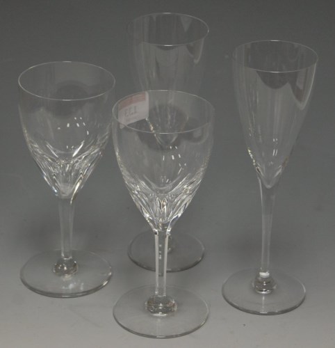 Lot 133 - A set of nine Baccarat glass champagne flutes,...