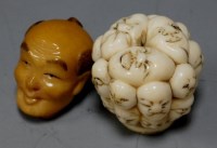 Lot 357 - A reproduction netsuke carved in the form a...