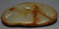 Lot 377 - A russet jade pebble, w.11cm