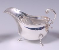 Lot 3162 - A Garrard & Co silver cream jug, having floral...