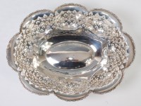 Lot 3193 - A George V silver table basket, of lobed and...