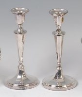 Lot 3194 - A pair of silver pedestal candlesticks, each...
