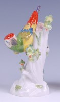 Lot 3101 - A Meissen porcelain model of a parrot upon a...