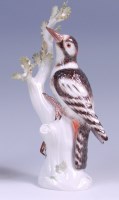 Lot 3102 - A Meissen porcelain model of a woodpecker upon...