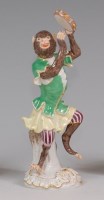 Lot 3113 - A modern Meissen porcelain monkey band figure,...