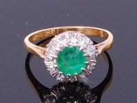 Lot 3240 - An 18ct gold, emerald and sapphire cluster...