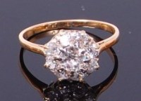 Lot 3241 - An 18ct gold diamond cluster ring, the centre...