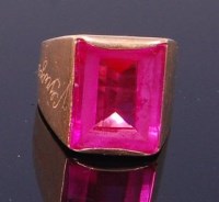 Lot 3253 - An 18ct gold and pink sapphire set dress ring,...