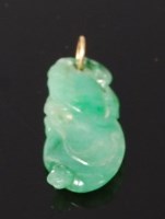 Lot 3258 - A Chinese celadon jade carved pendant, of...