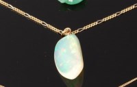 Lot 3259 - A polished opal pendant, weighing approx 15ct,...