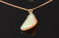 Lot 3260 - A polished opal pendant, weighing approx 11ct,...