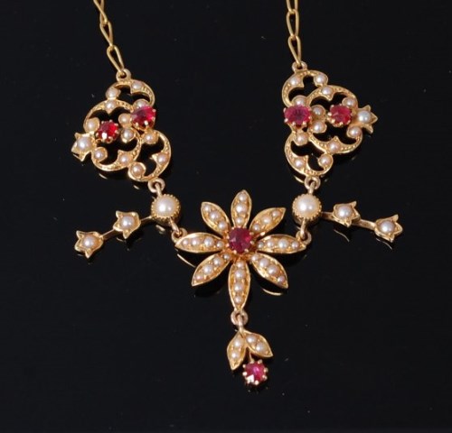 Lot 3265 - An Edwardian 18ct gold, ruby and seed pearl...