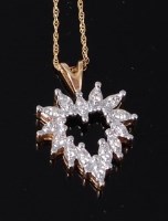 Lot 3266 - A modern 14ct gold and diamond set pendant, of...