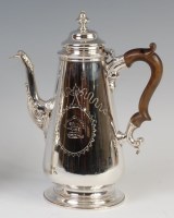 Lot 3197 - A Victorian silver coffee pot in the early...