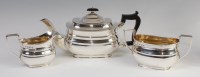 Lot 3198 - A George V silver three-piece tea set in the...