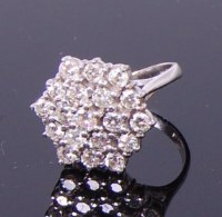 Lot 3249 - An 18ct white gold and diamond flower head...
