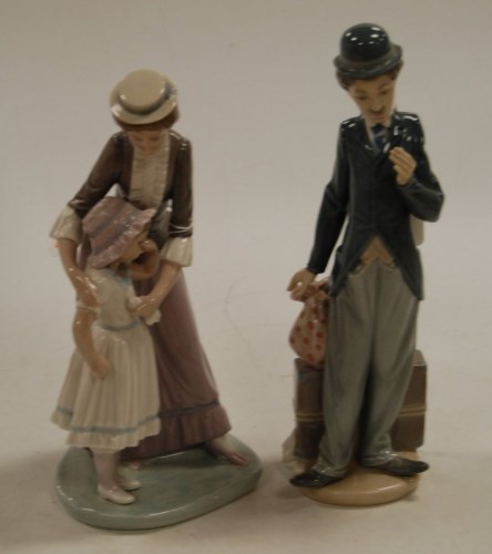 Lot 9 - A Lladro porcelain figure of Charlie Chaplin...