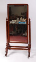 Lot 1586 - A Victorian flame mahogany cheval mirror, the...