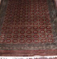 Lot 1519 - A Persian woollen fine-weave Bokhara carpet,...