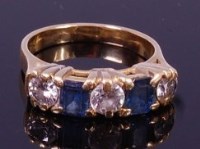 Lot 1339 - An 18ct gold, sapphire and diamond ring,...