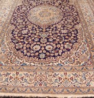 Lot 1528 - A Persian woollen Nain carpet, having a blue...