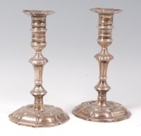 Lot 1147 - A pair of George II silver candlesticks, each...