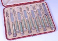 Lot 1166 - A cased set of six silver butter knives and...