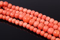 Lot 1187 - A beaded and graduated coral single string...